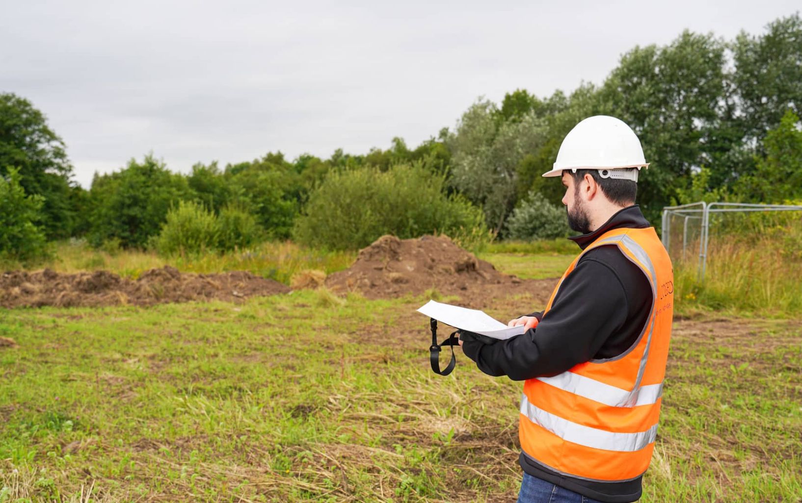 engineer looking at plan drawings