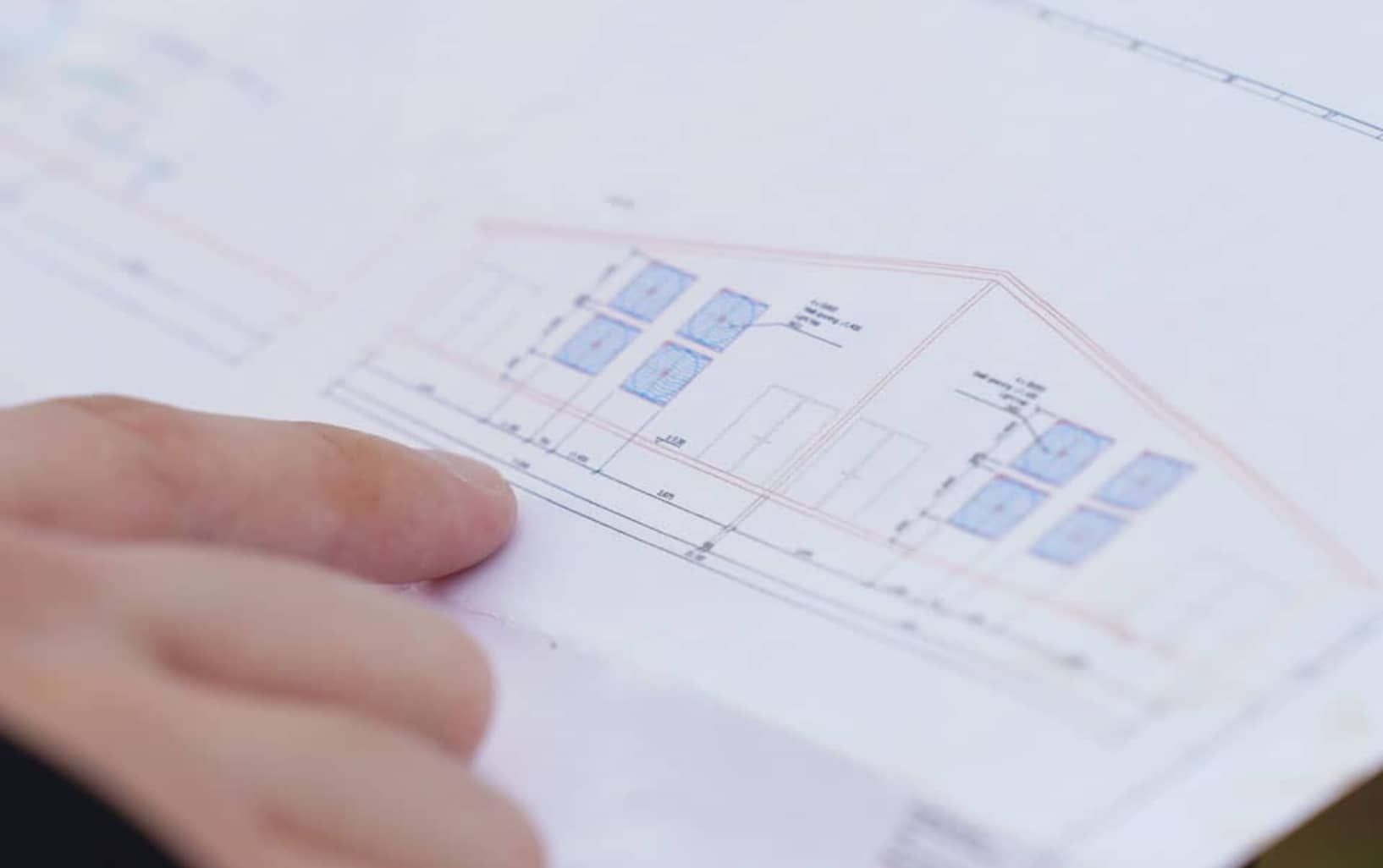 engineer looking at plan drawings